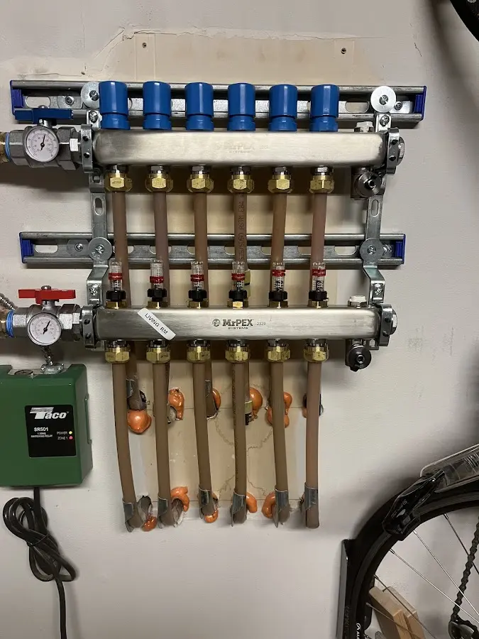 Plumber performing Water Heater Repair at a residential property in Southborough